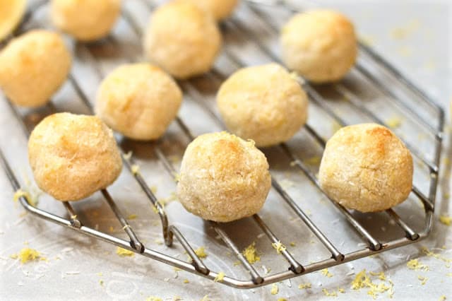 A rack with lemon coconut macaroons on it. 