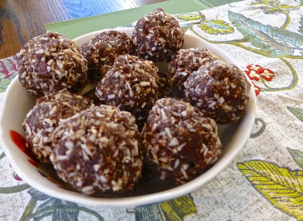 A bowl full of chocolate energy balls. 