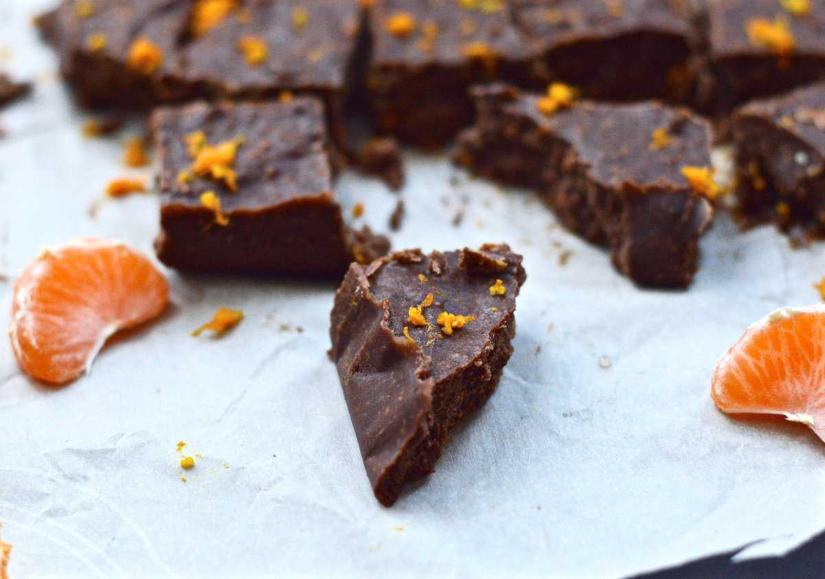 Piece of chocolate orange fudge with many other pieces of fudge in the background