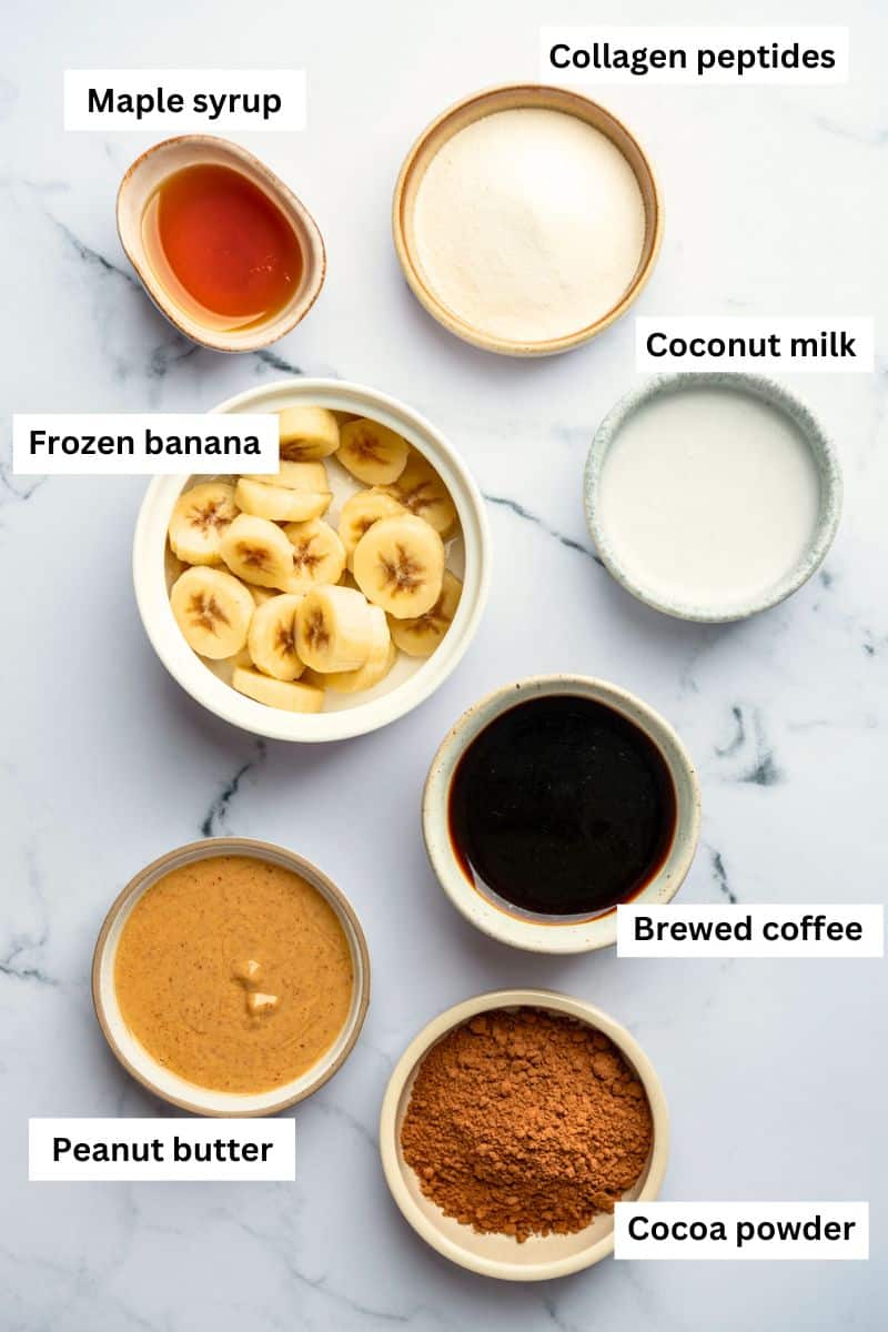 Bowls filled with different ingredients including banana slices, milk, maple syrup, coffee, and peanut butter.