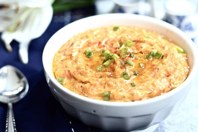 A bowl full of paleo roasted red pepper dip.