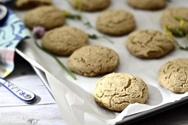 Plantain cookies on a baking sheet lined with parchment paper.
