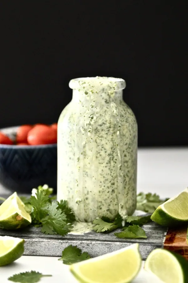 A close up shot of a bottle of Whole30 Cilantro Lime Dressing