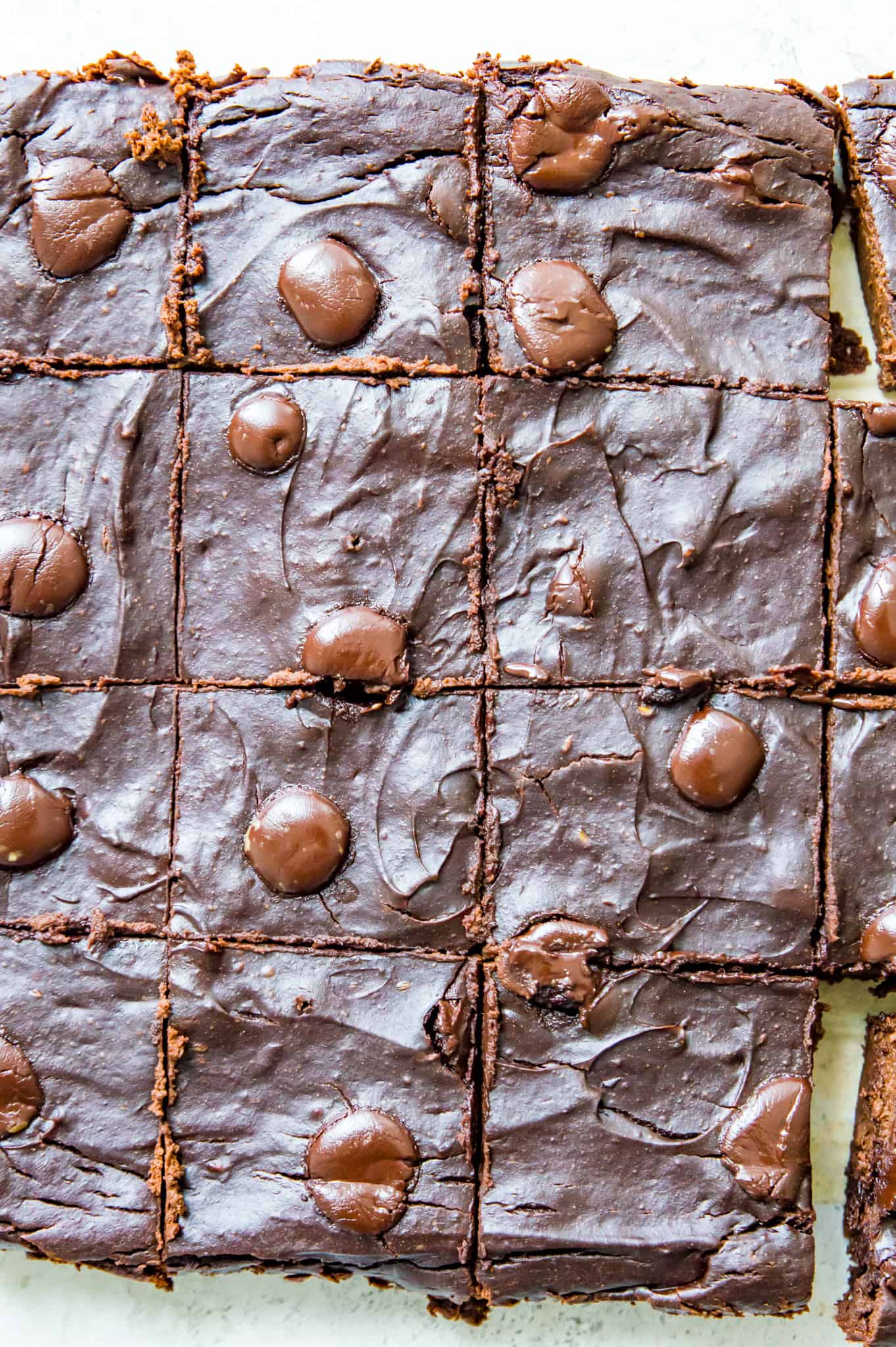 A batch of avocado brownies cut into pieces.