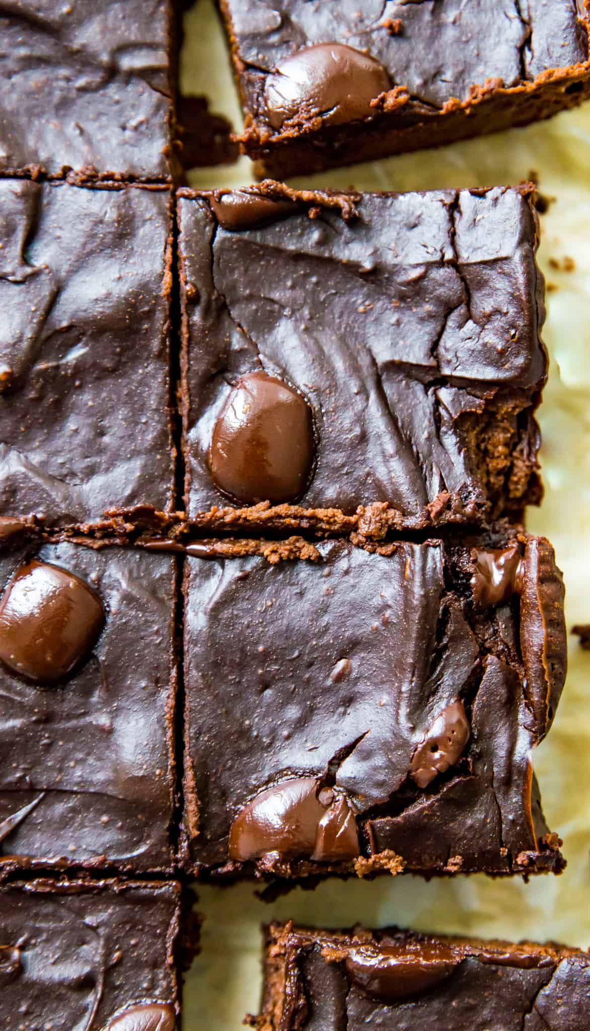 Double chocolate avocado brownies cut into pieces on a baking sheet.