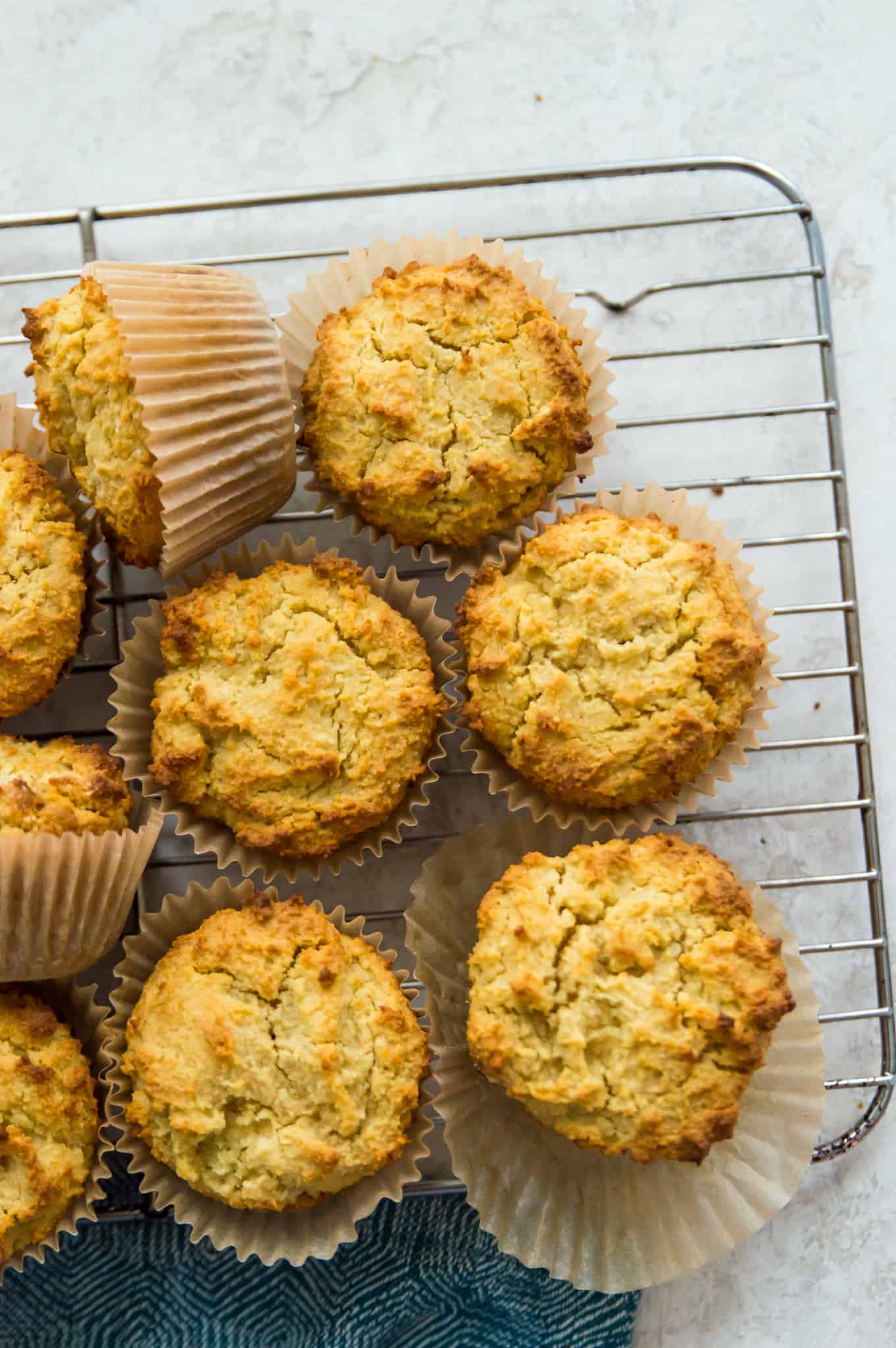 An overhead view of paleo cornbread muffins on a wire rack.