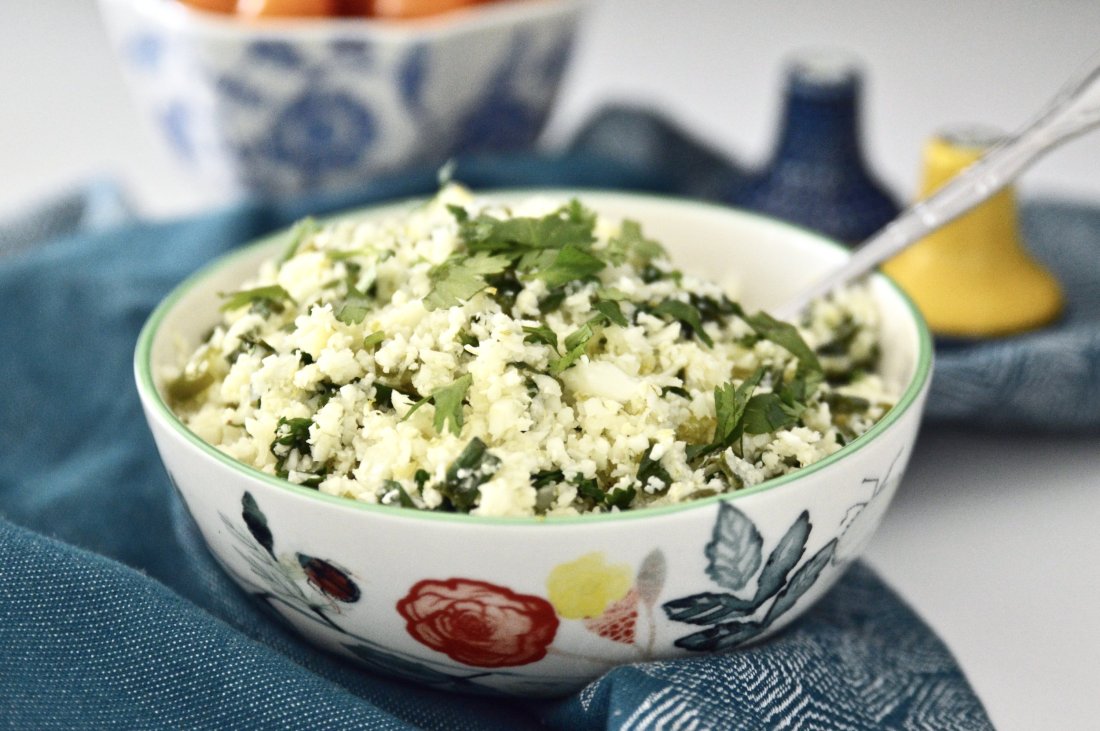 Whole30 Cilantro Lime Cauliflower Rice is such a great alternative to plain cauliflower rice. Because let's be honest, cauliflower rice can be a little boring. But not this Cilantro Lime Cauliflower Rice! This dish is also paleo, AIP and vegan friendly and is incredibly easy to make. Your whole family will love it! #whole30 #cauliflower #rice #paleo #vegan #gaps #aip #sidedish #easy