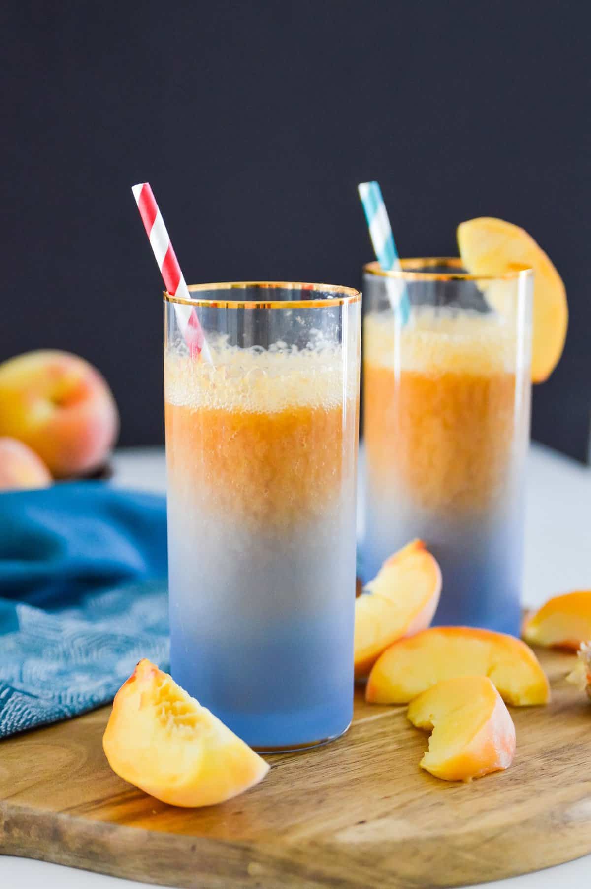 This Peach Ginger Fizz is the perfect summer drink! Made with no added sugars and only 3 ingredients you are going to love this Peach Ginger Fizz. Serve this Peach Ginger Fizz at your next party for an easy, healthy cocktail. 