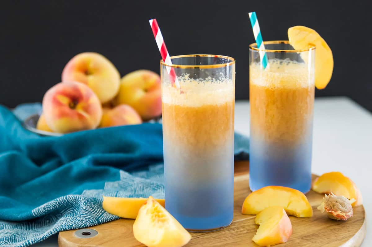 This Peach Ginger Fizz is the perfect summer drink! Made with no added sugars and only 3 ingredients you are going to love this Peach Ginger Fizz. Serve this Peach Ginger Fizz at your next party for an easy, healthy cocktail. 