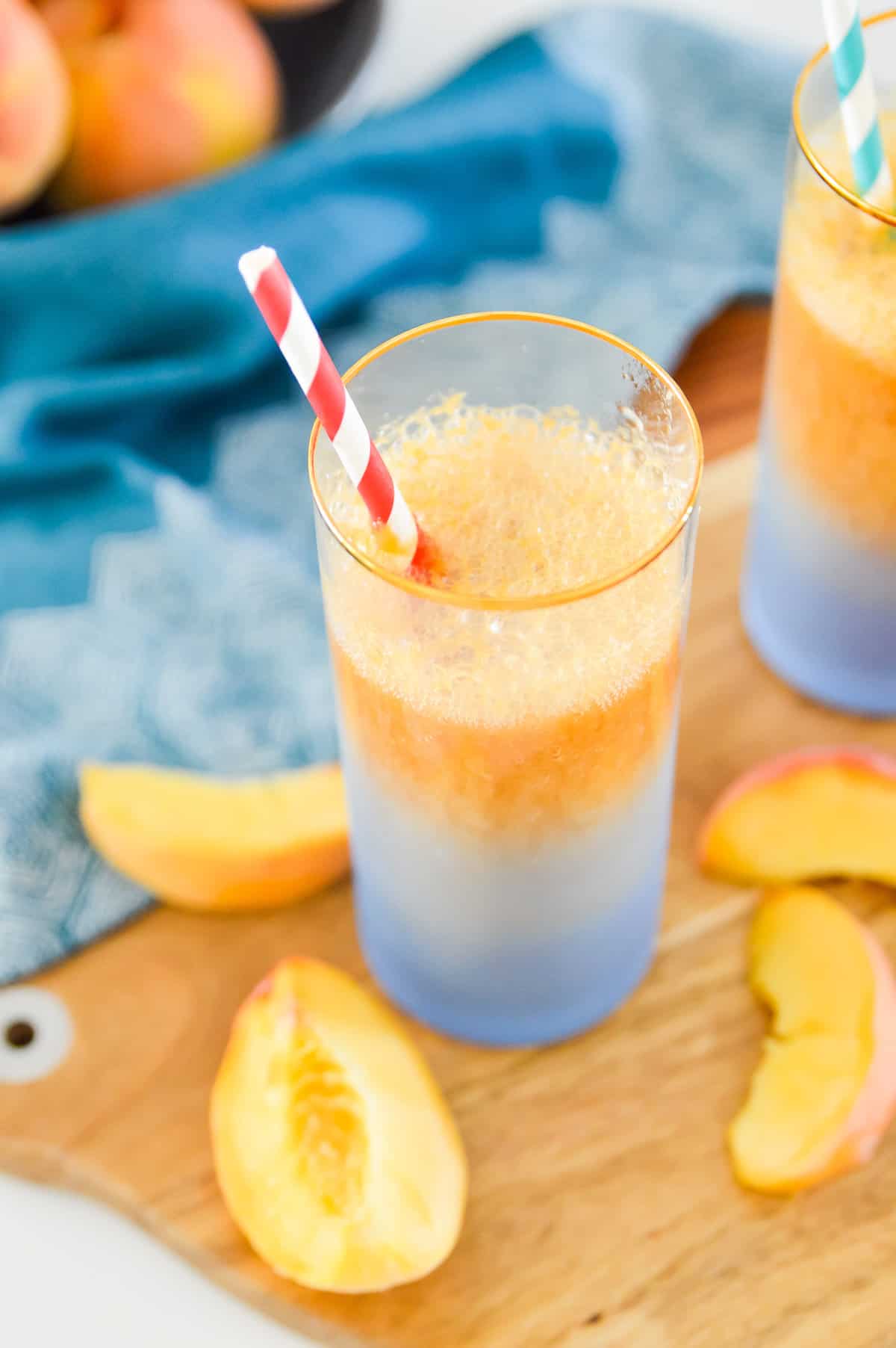 This Peach Ginger Fizz is the perfect summer drink! Made with no added sugars and only 3 ingredients you are going to love this Peach Ginger Fizz. Serve this Peach Ginger Fizz at your next party for an easy, healthy cocktail. 