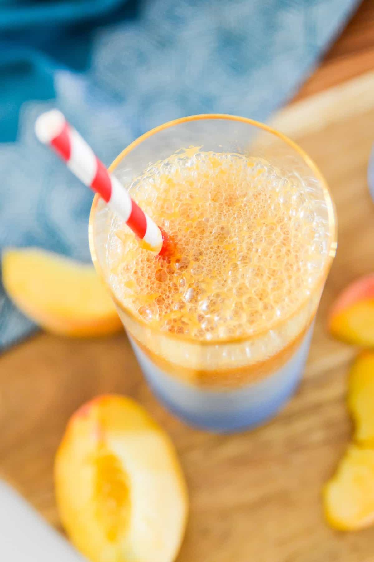 This Peach Ginger Fizz is the perfect summer drink! Made with no added sugars and only 3 ingredients you are going to love this Peach Ginger Fizz. Serve this Peach Ginger Fizz at your next party for an easy, healthy cocktail. 