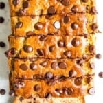 A loaf of gluten free chocolate chip banana bread cut into pieces.
