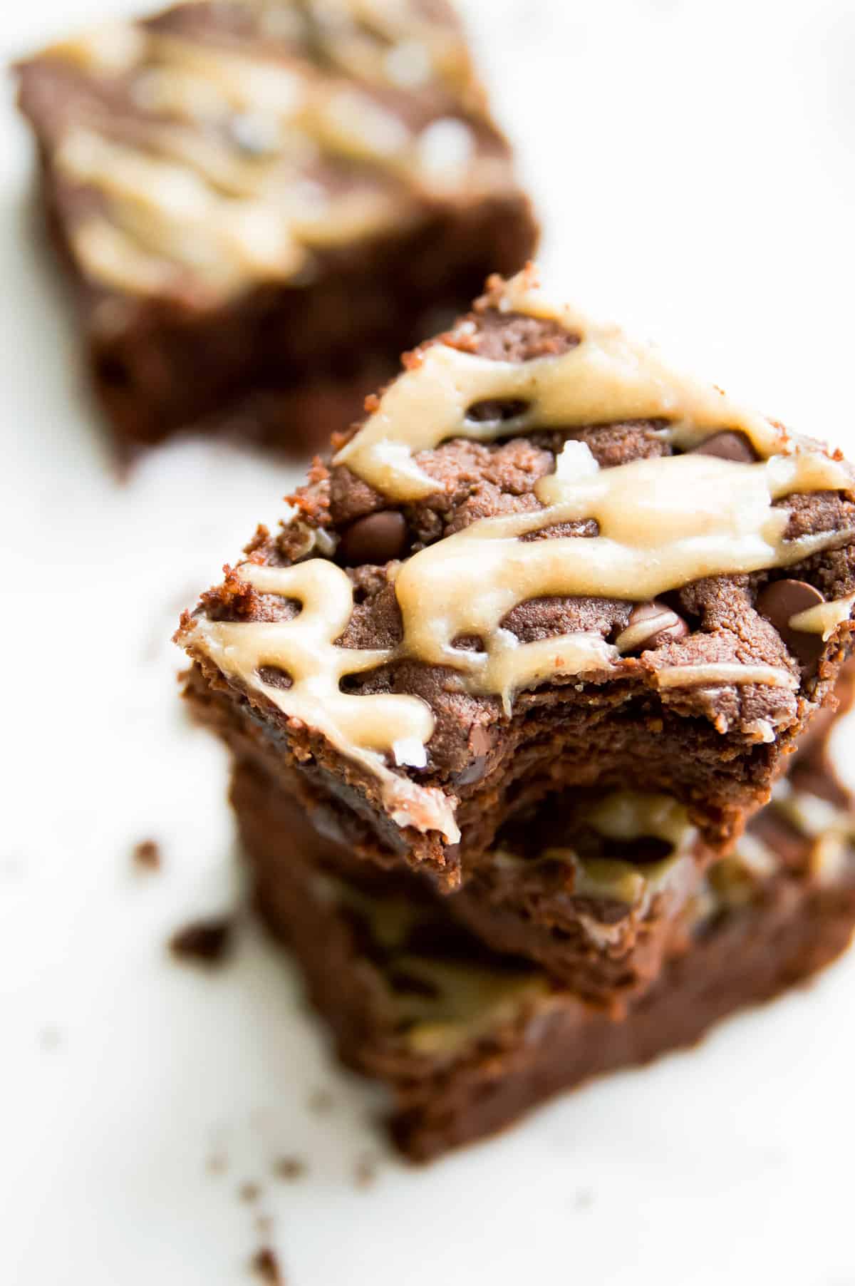 A stack of dairy free brownies with caramel 