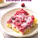A plate with a cranberry lemon square on it.