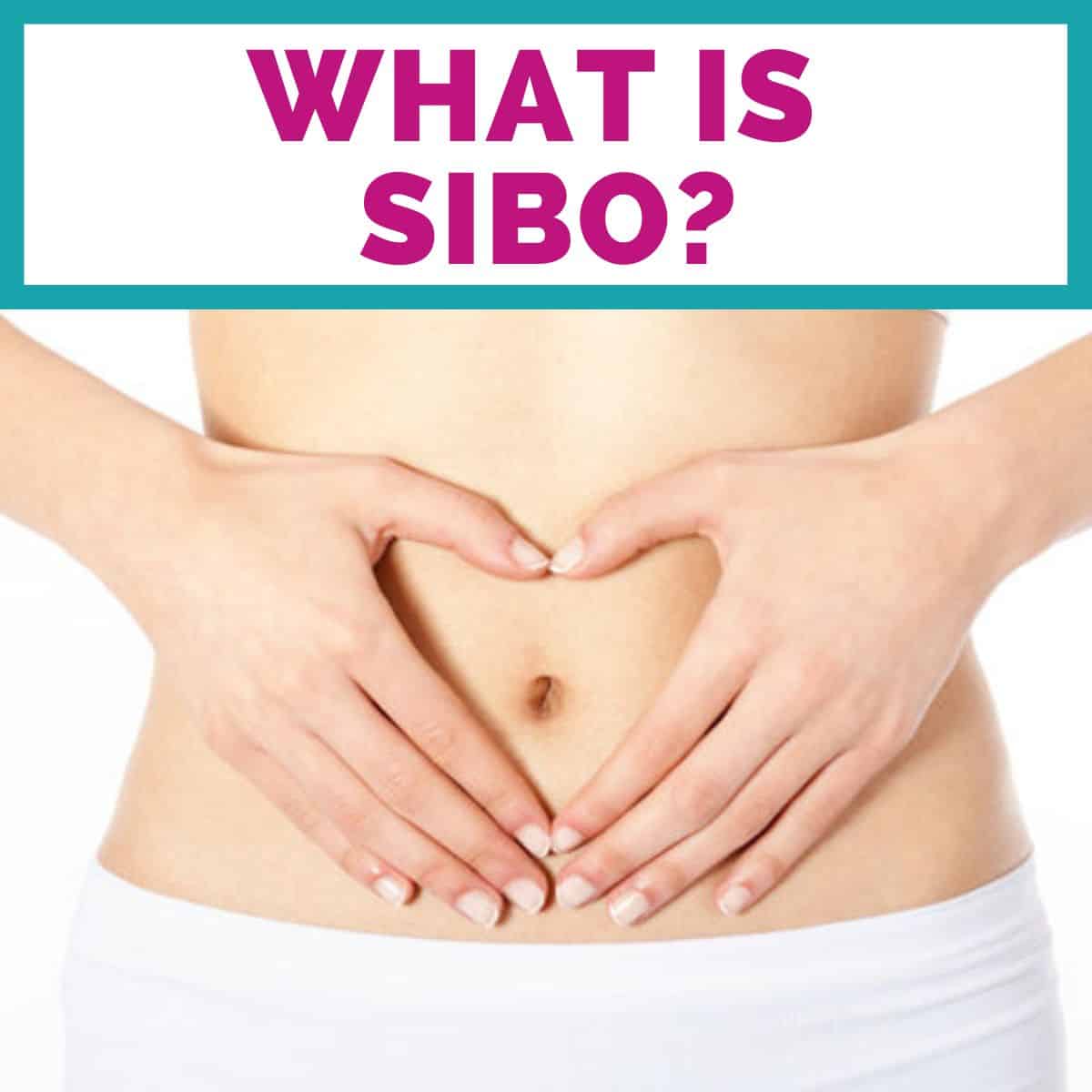 A women with her hands on her stomach.