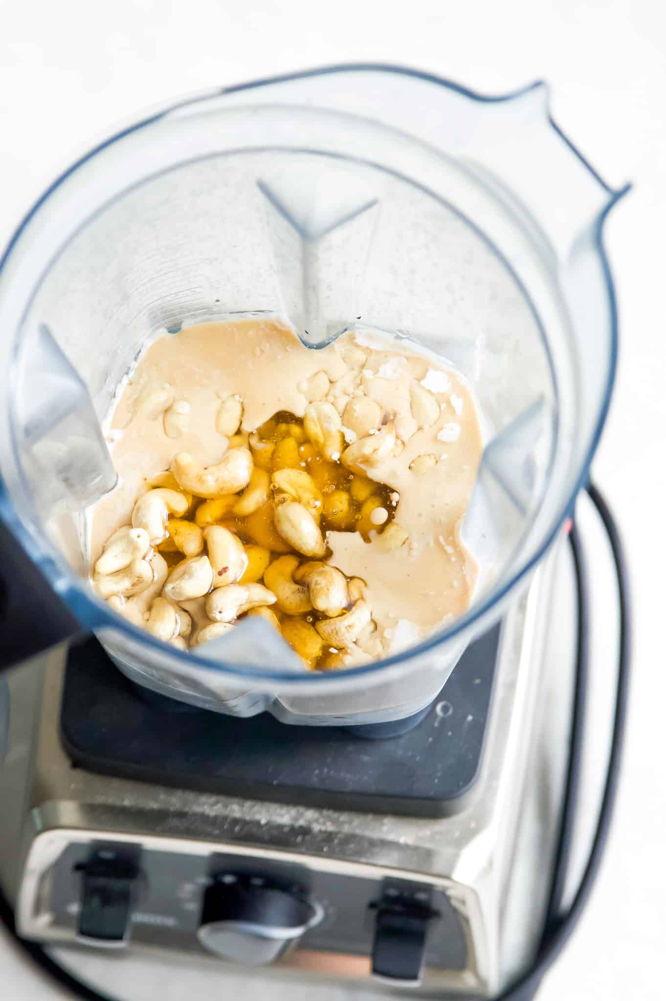 Coconut milk, honey, cashews and vanilla in a vitamix blender.