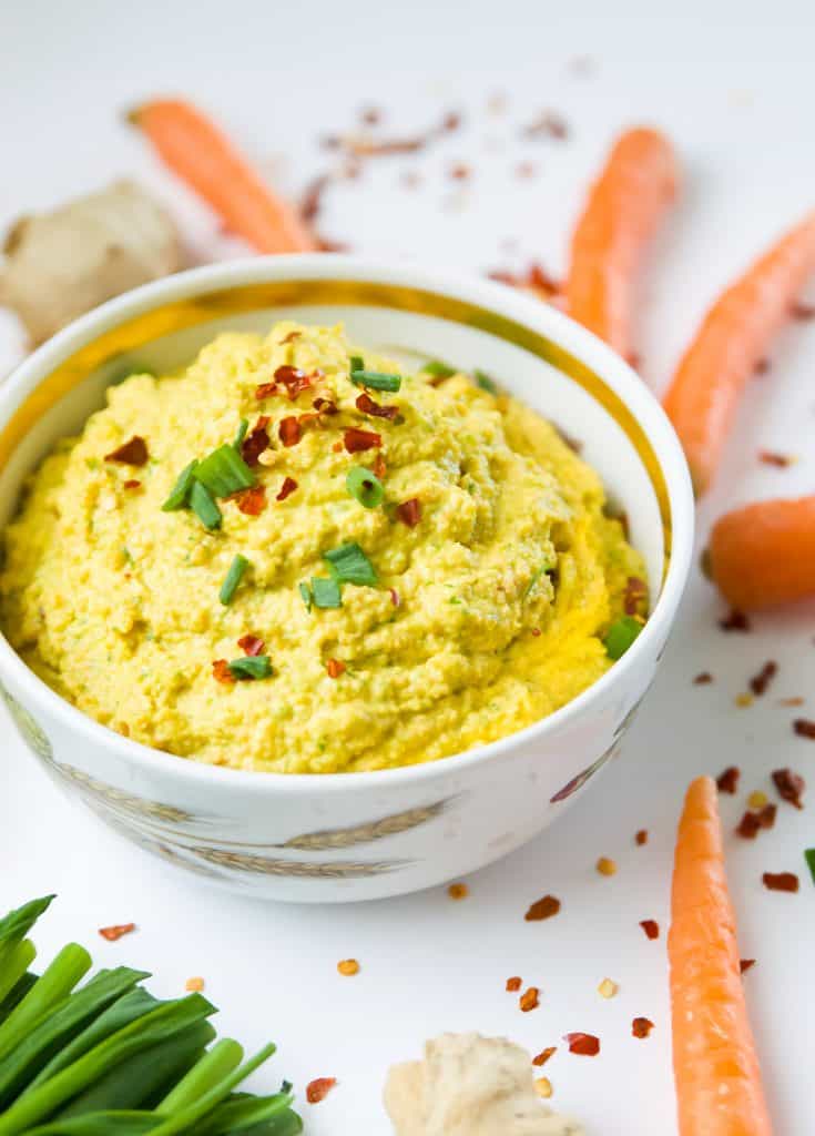A bowl of carrot dip with chilis 