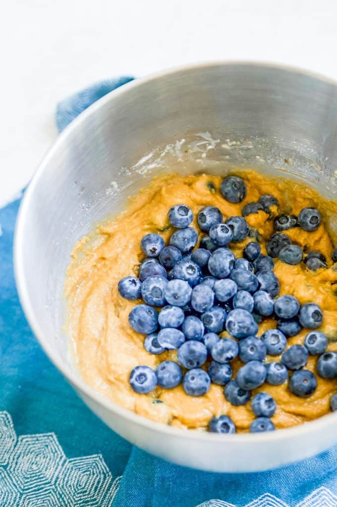 Batter to make gluten free blueberry muffins in a large bowl.