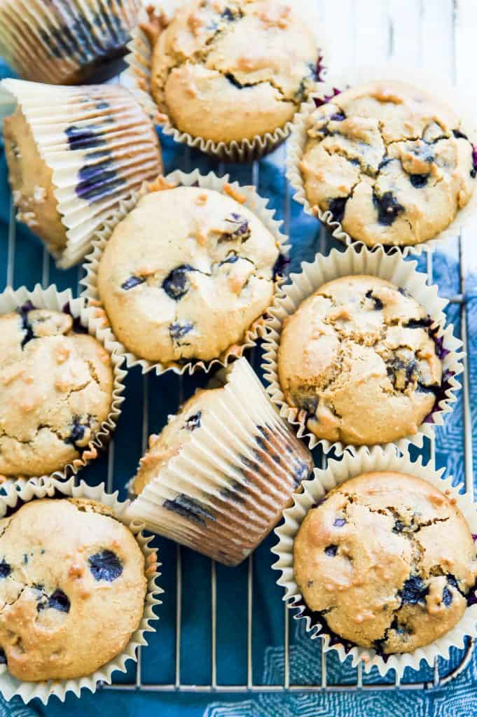 An overhead shot of gluten free blueberry muffins on a metal rack