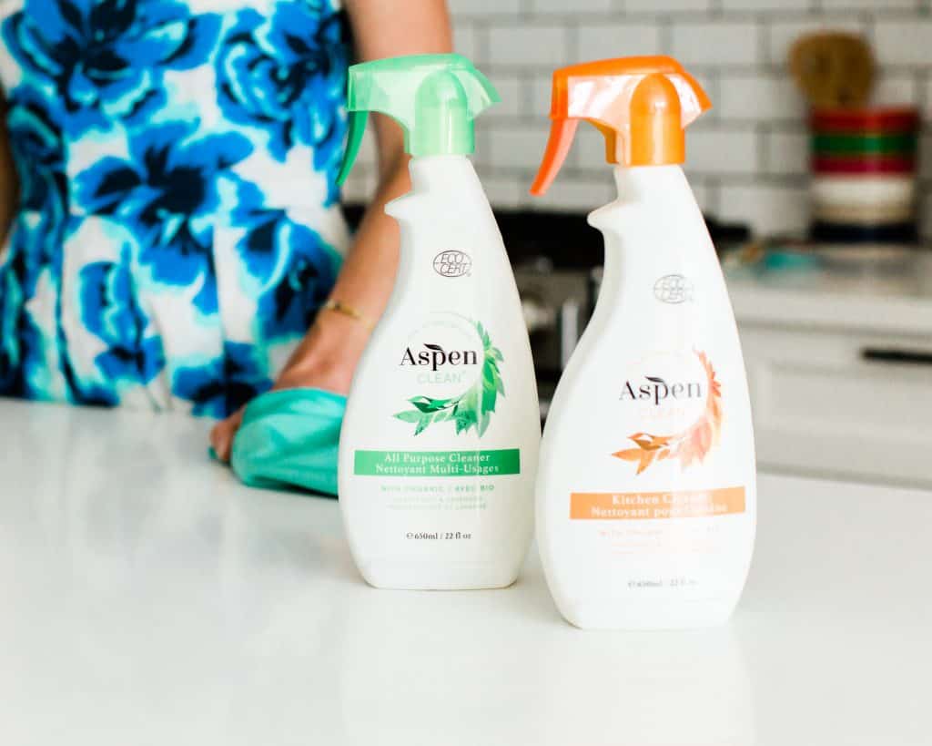 Aspen Clean cleaning products on a kitchen counter.