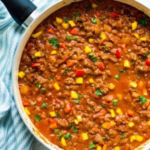 A pan filled with a healthy sloppy Joe recipe, garnished with parsley.