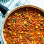 A pan filled wth healthy sloppy Joes topped with parsley.