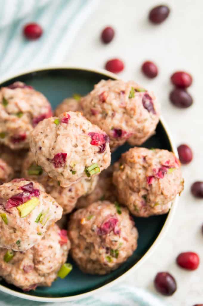 A bowl full of healthy turkey meatballs with cranberry 