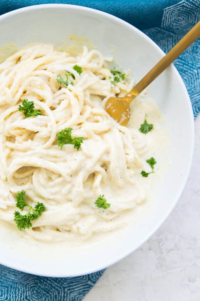 A bowl of dairy free Alfredo sauce on pasta 