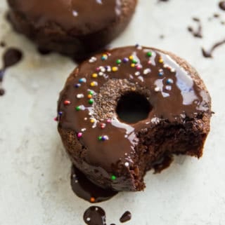 A dairy free chocolate donut with icing