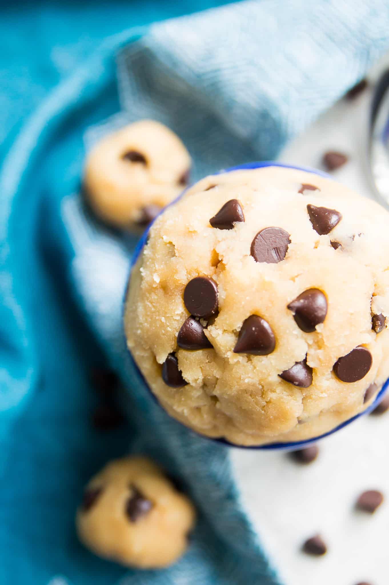A large bowl of edible gluten free cookie dough with chocolate chips.