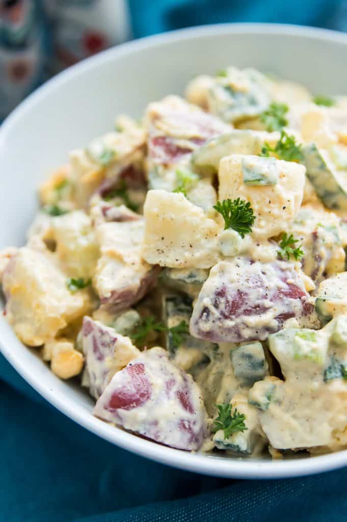 A bowl of potato salad made with red potatoes 