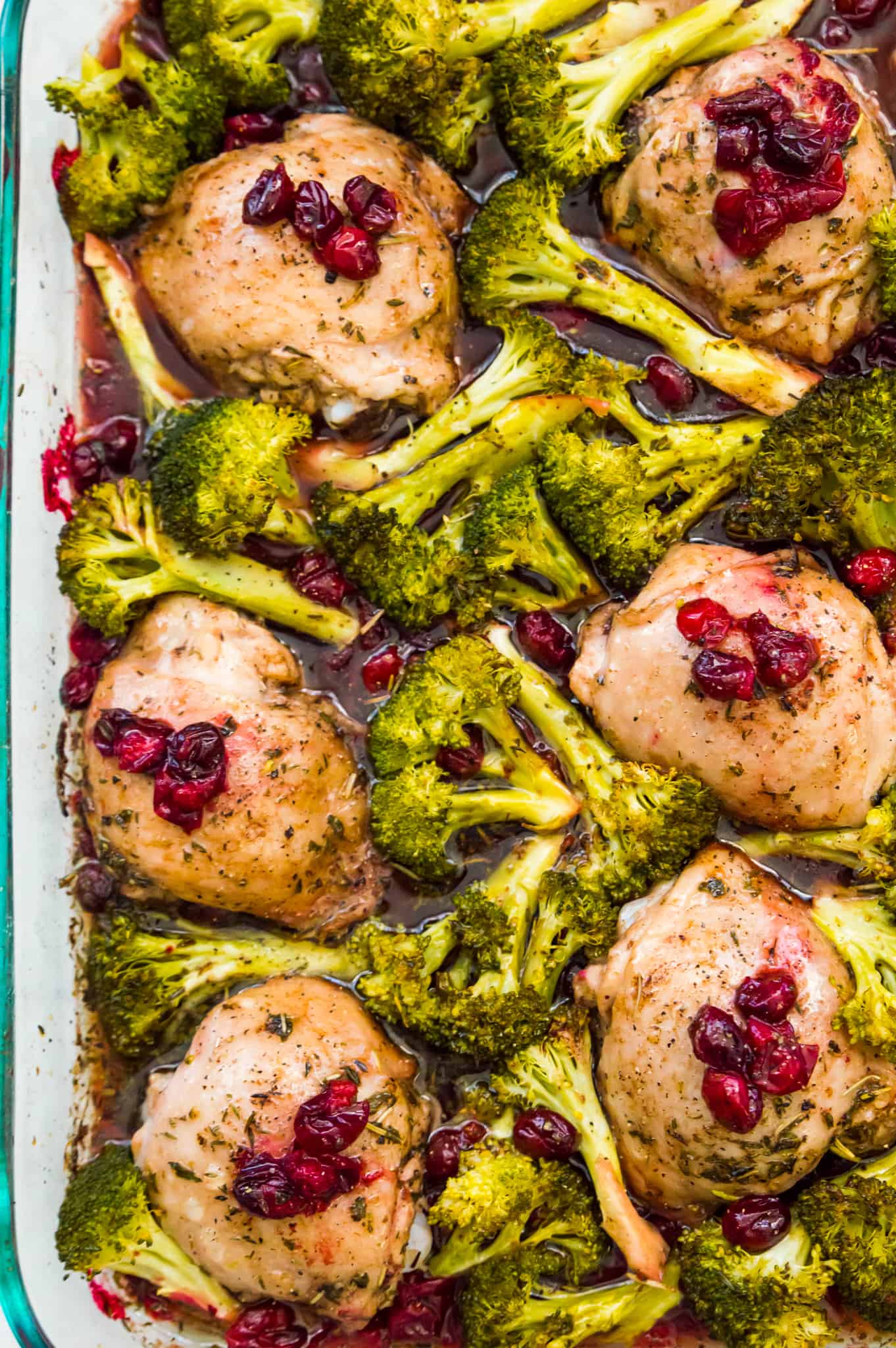 A pan of cranberry maple chicken filled with broccoli.