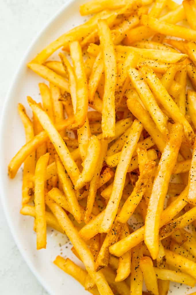 A plate of air fryer frozen French fries