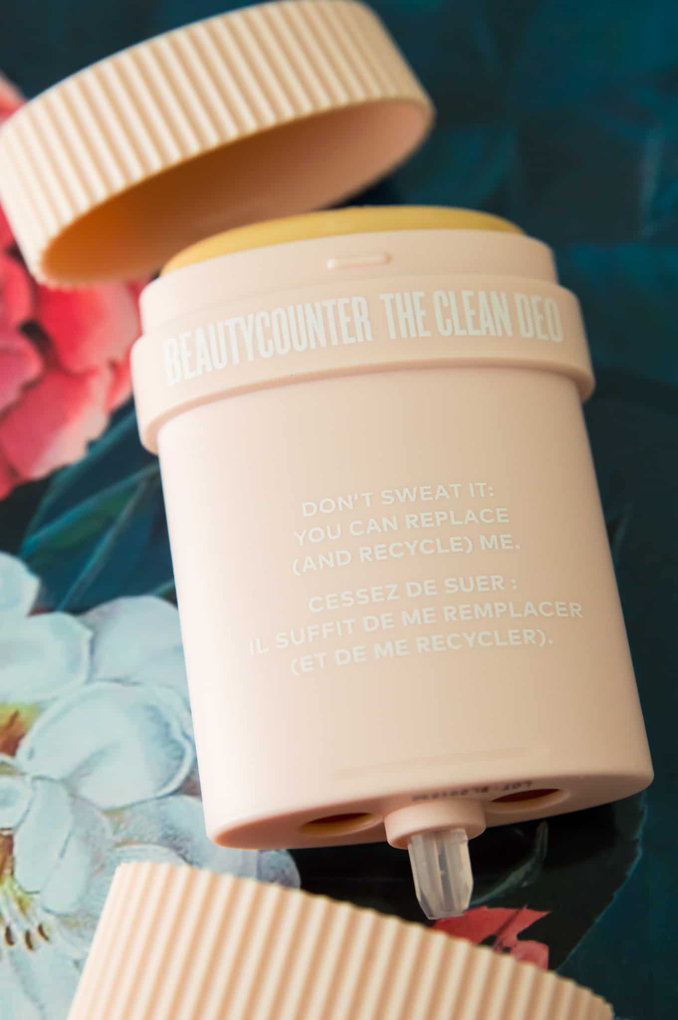 The Beautycounter deodorant refill on a floral mat. 