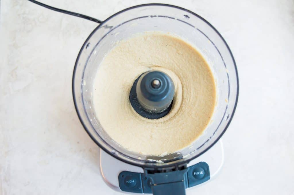 Blended cashews and coconut milk in a food processor.