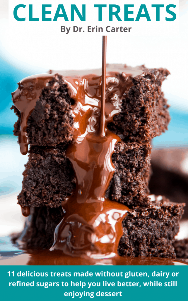 Clean Treats Cookbook The cover of a clean treats cookbook with a stack of brownies on it with chocolate sauce being poured over it.
