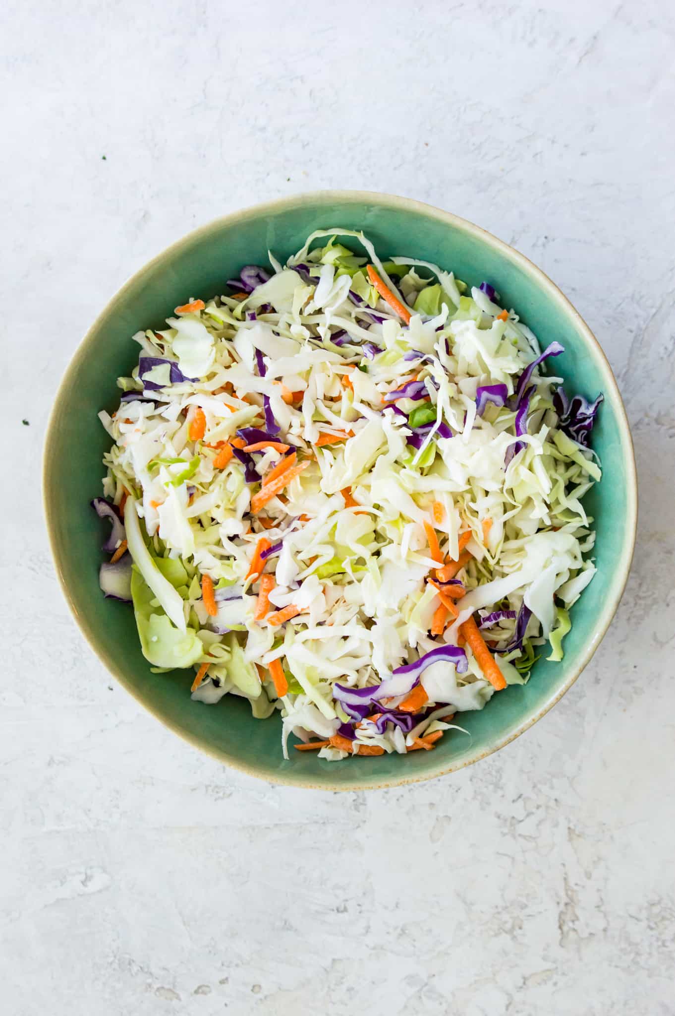 A bowl of shredded cabbage.