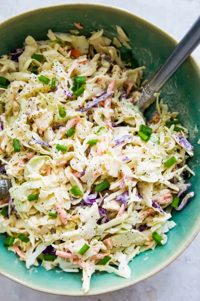 This keto coleslaw is the best low carb side dish. The dressing is made with mayonnaise, apple cider vinegar and mustard and is so easy to make. It's also paleo and Whole30 compliant. 