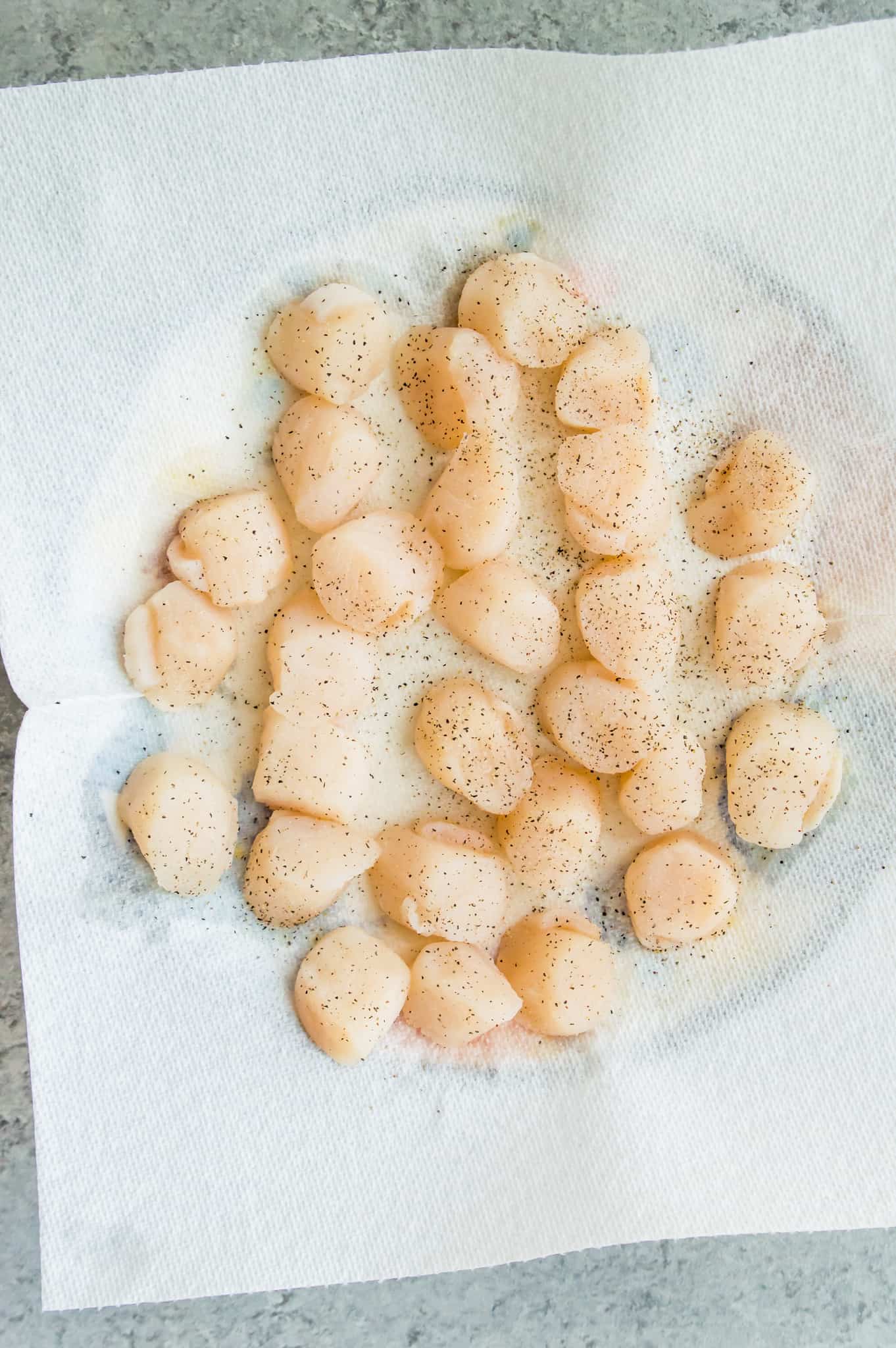 Scallops on a paper towel.