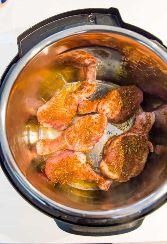 Chicken drumsticks in the bowl of an Instant Pot.
