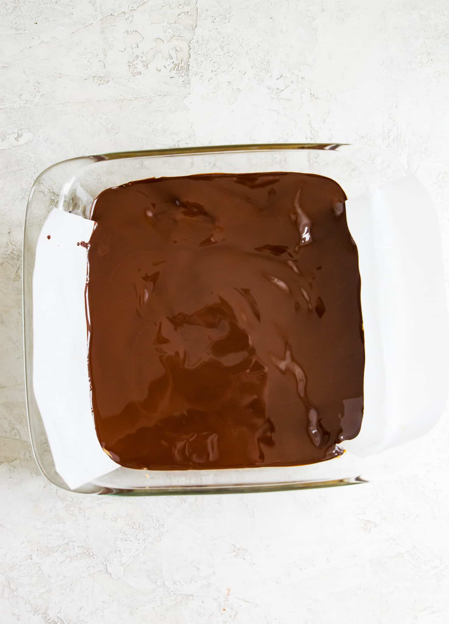 A baking pan filled with melted chocolate. 