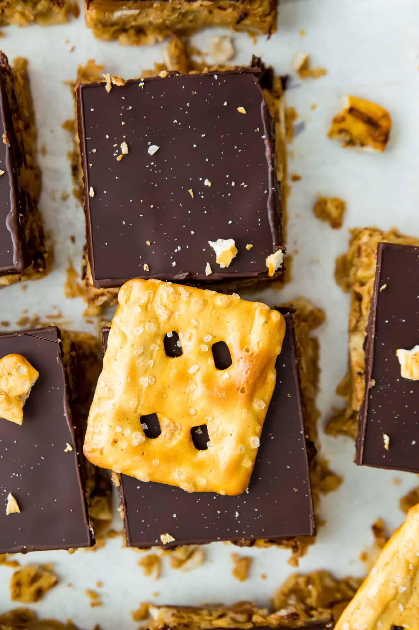 Peanut butter pretzel bars topped with chocolate and crushed pretzels.