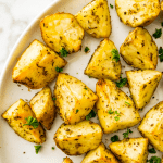 A plate of diced potatoes that were cooked in an air fryer