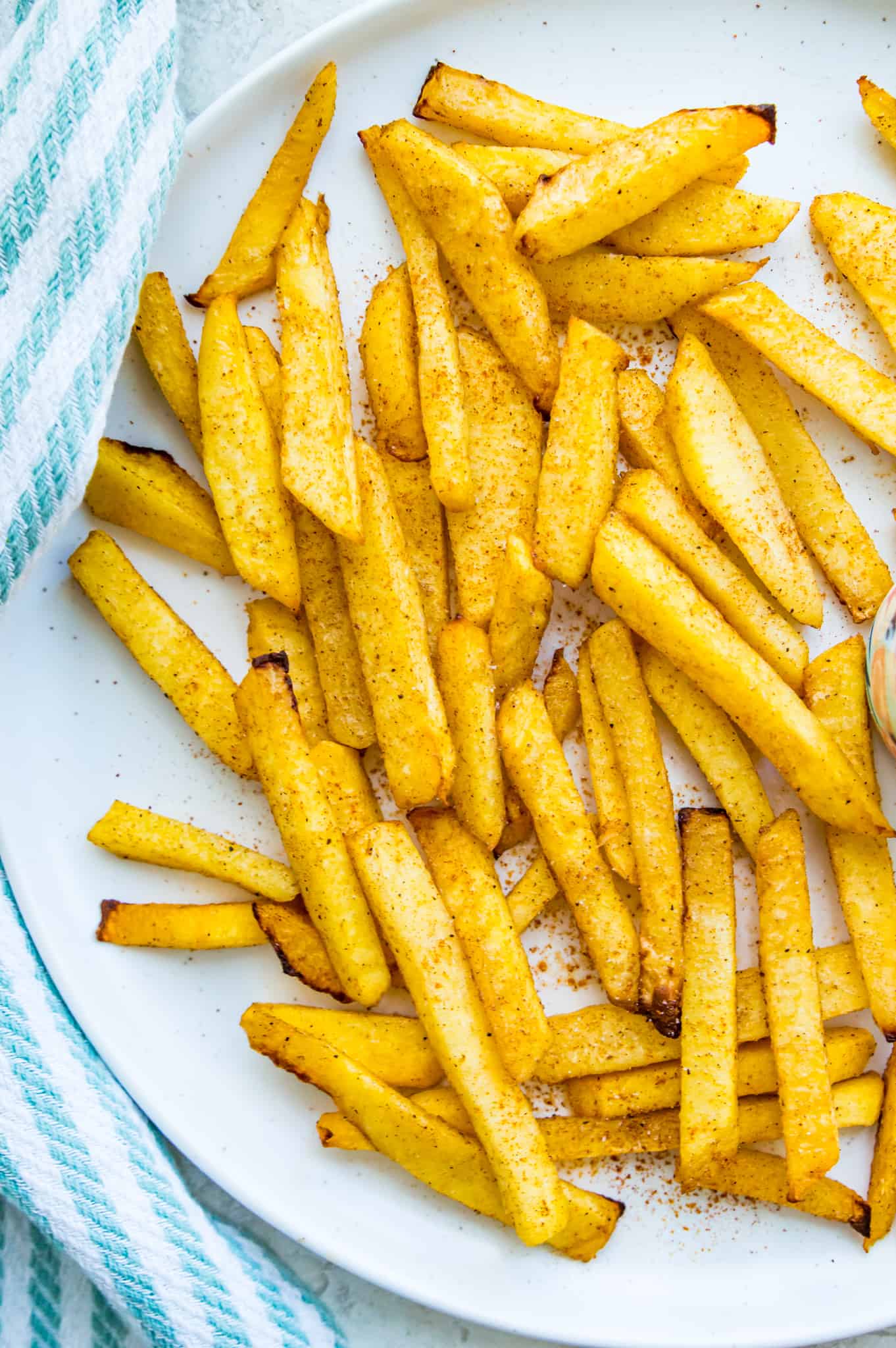 A plate of turnip fries that were cooked in an air fryer.