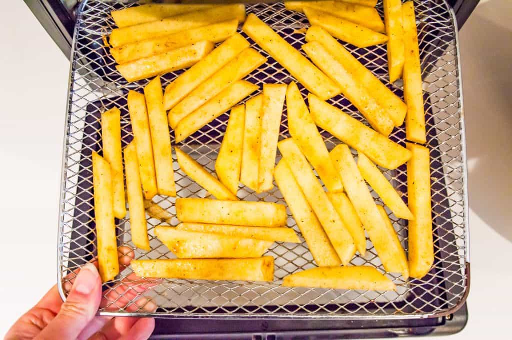 Turnip fries on an air fryer tray.