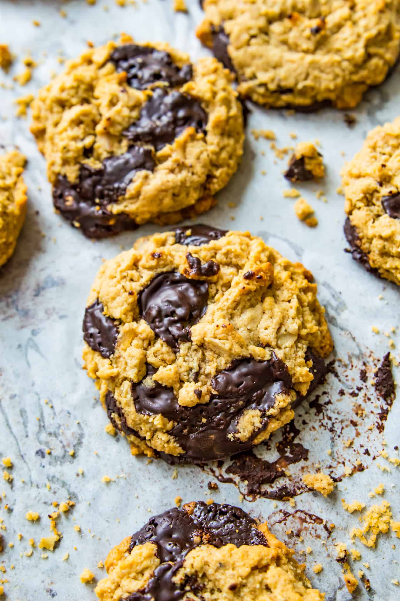 A baking sheet full of protein cookies with chocolate. 