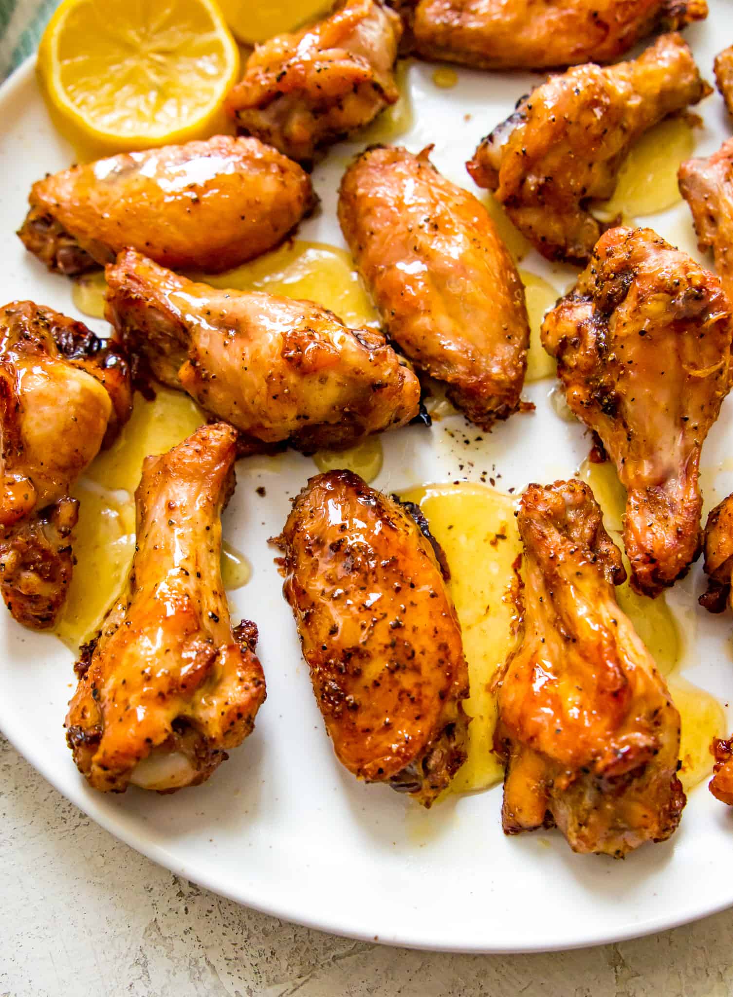 A plate of honey lemon pepper glazed chicken wings. 