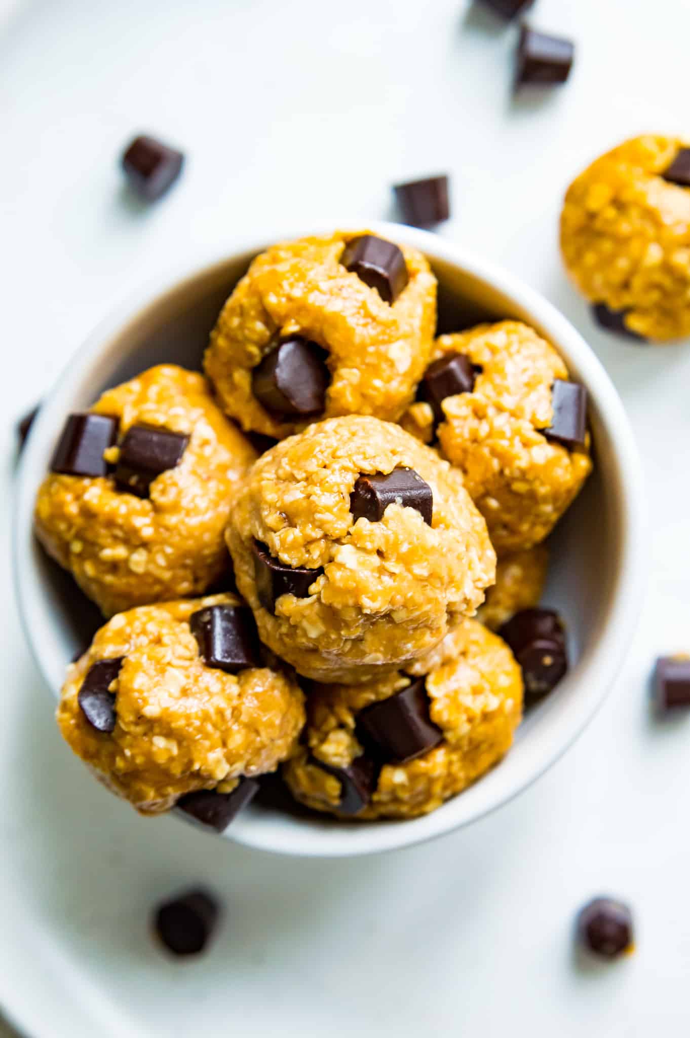 A bowl filled with peanut butter bliss balls. 