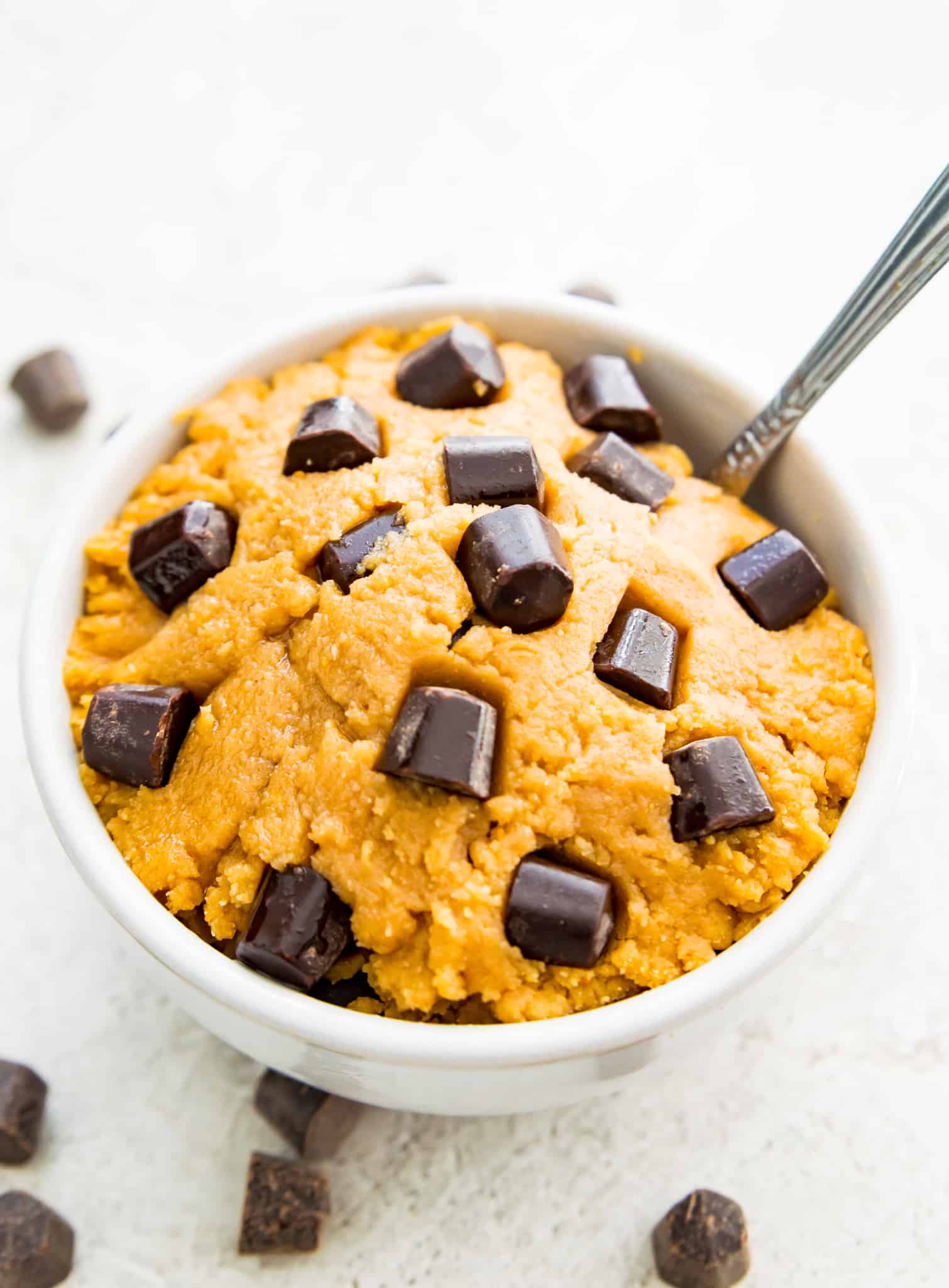 A bowl of protein powder cookie dough with chocolate chips on top.