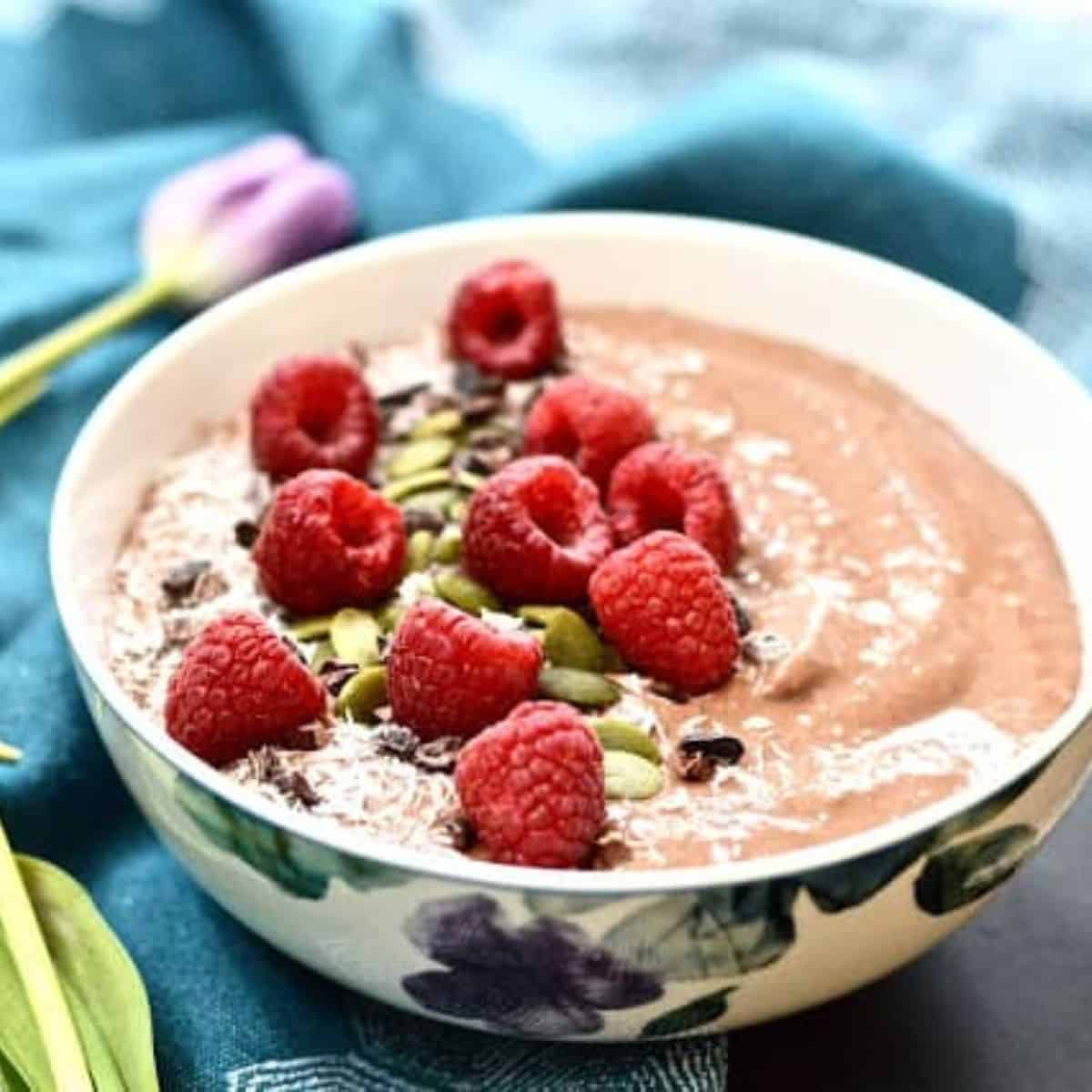 https://www.pureandsimplenourishment.com/wp-content/uploads/2022/03/chocolate-raspberry-smoothie-bowl-feature-image.jpg